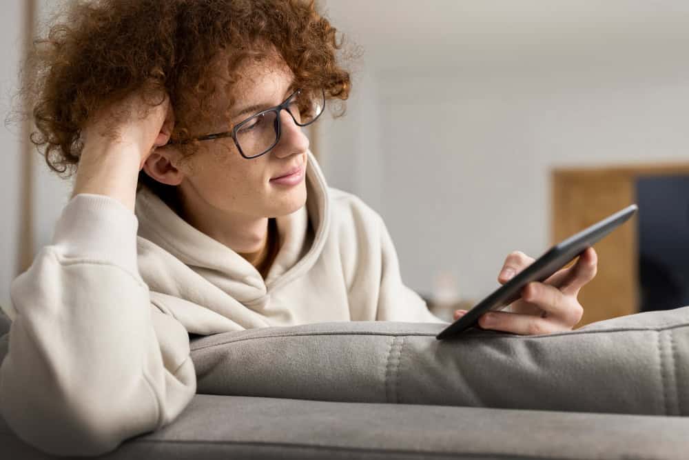 Teen using tablet at home during Washington Addiction Treatment online session