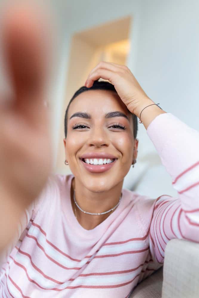 Woman holding her phone during online mental health treatment in Washington