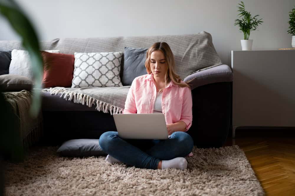 Woman typing during virtual alcohol addiction treatment in Washington session