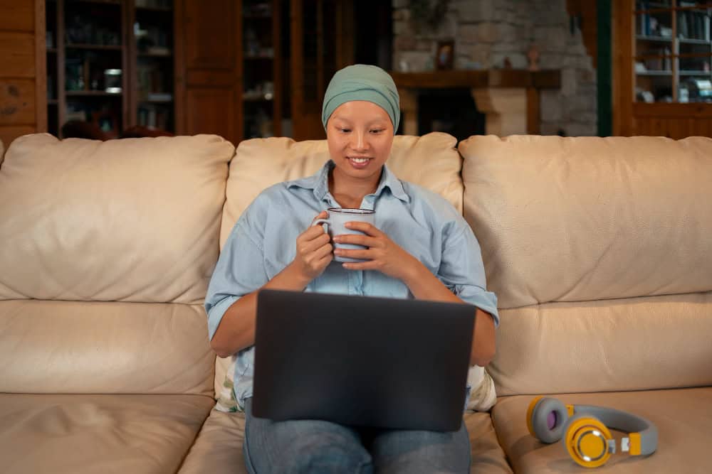 Woman using laptop during virtual alcohol addiction treatment in Washington at home