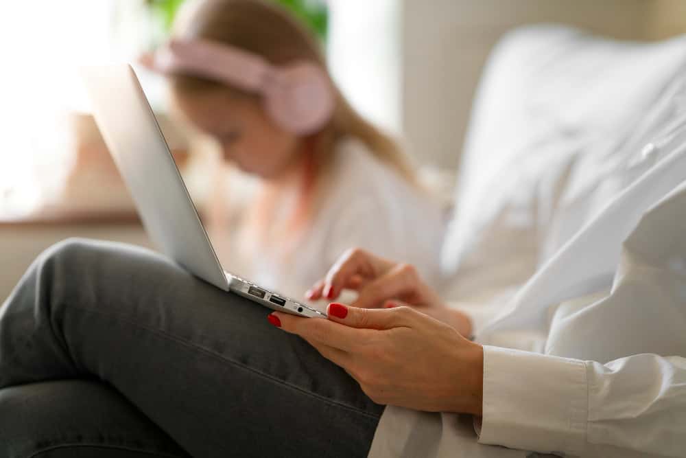 Mother working from home during Virtual CBT in Washington online therapy session