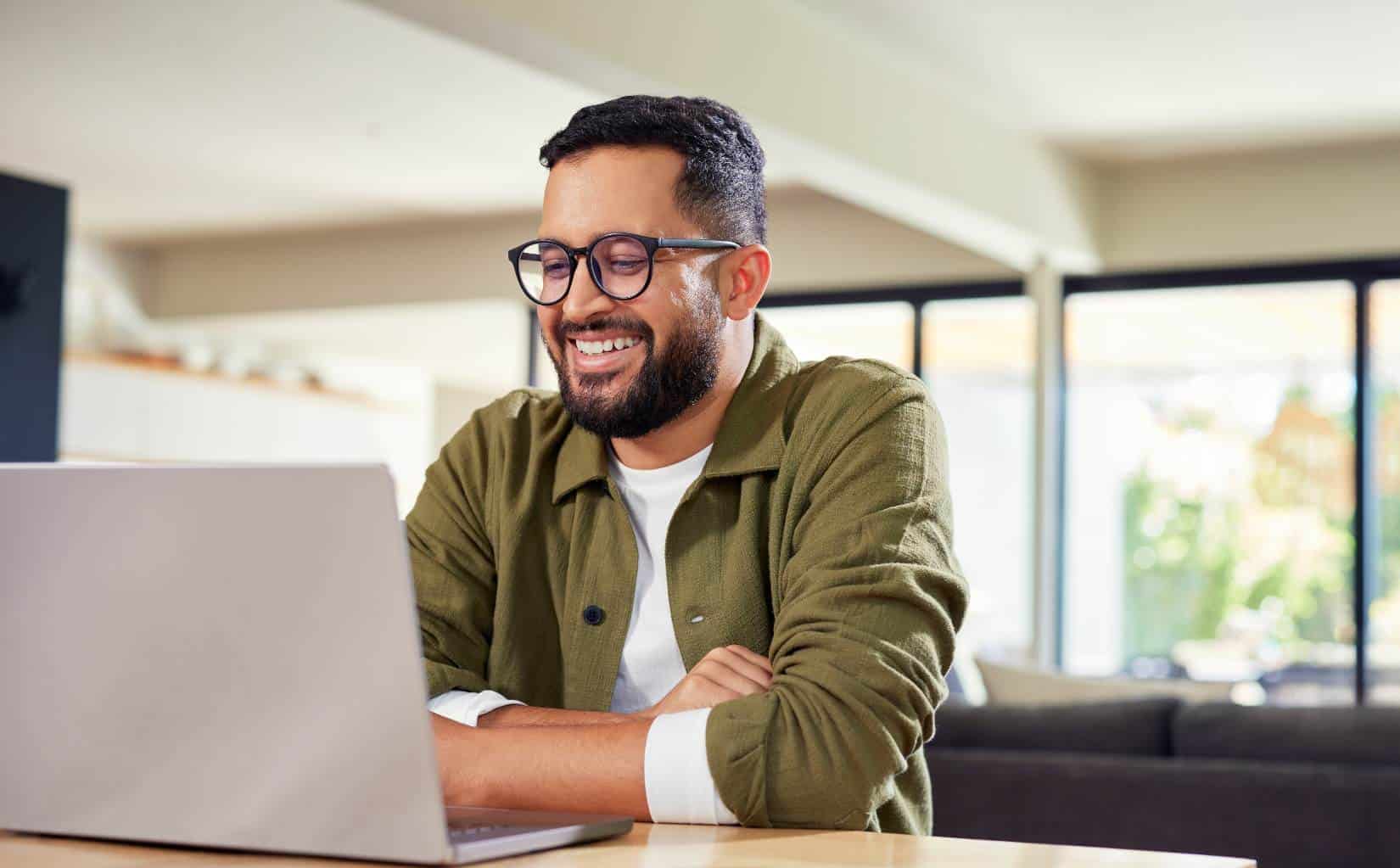 Client on a laptop during virtual addiction treatment programs in Washington.